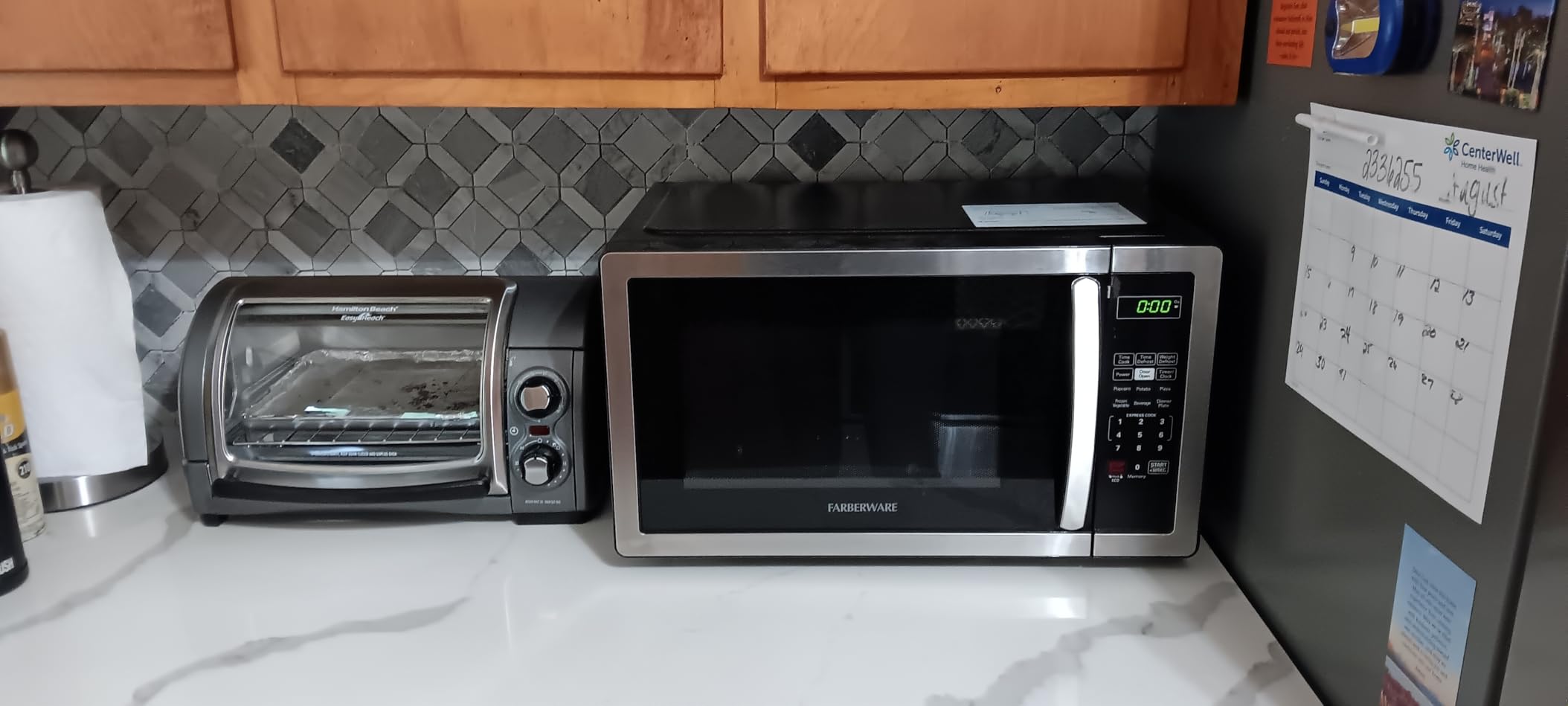Farberware 1.1 Cu. Ft. Countertop Microwave Oven - 1000 Watts Power, Auto Cook Settings, Defrost, Easy Clean and Child Safety Lock - Stainless customer photo 1