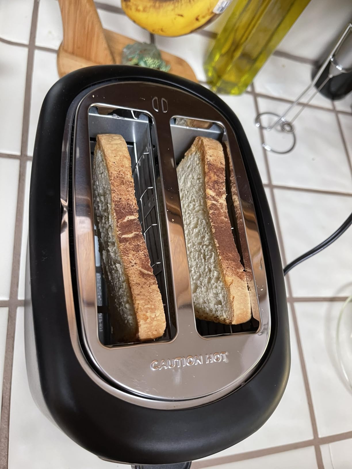 Amazon Basics 2 Slice Toaster, Extra Wide Slots for Bagels, 6 Browning Settings, Removable Crumb Tray, Defrost/Cancel/Bagel Buttons, Cord Wrap, 900W, Black & Silver customer photo 2